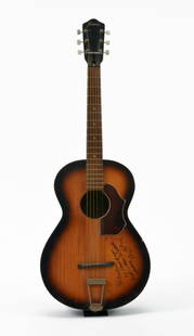 Guitar inscribed by Les Paul to Carlos Santana: Acoustic guitar with trapeze tailpiece signed by Les Paul, to Carlos Santana. Santana is considered one of the greatest guitarists of all time and Les Paul was an admirer of his work. Lester