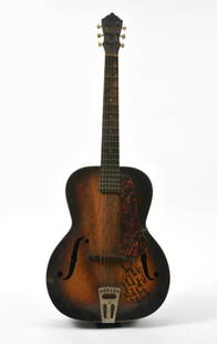 Les Paul inscribed signed guitar to Bono: Archtop guitar that Les Paul signed to Bono from U2. Les Paul respected U2 as a band, and as he already had a large amount of archtop guitars in his possession, he decided to sign this one to Bono. 