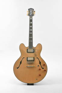 1985 Epiphone signed by Noel Gallagher of Oasis: An electric 1985 archtop Epiphone signed by Noel Gallagher, the lead singer of famous British band Oasis. The consigner and Gallagher met up on one of Oasis's early tours - he and Noel had been