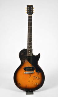 Gibson Les Paul Junior used by U2: A 1955 Gibson Les Paul Junior, single cutaway solidbody, used in one of U2's studio recording sessions. Sunburst finish, which is the original finish for the Les Paul Junior. Features a mahogany