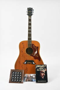 Johnny Cash & Kitty Wells Signed 1968 Gibson Dove: A 1968 Gibson Dove signed by Johnny Cash & Kitty Wells. Kitty Wells, a famous country singer in her own right, was also a part of Johny Cash's ensemble for many of his performances. This rare '68