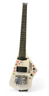 Johnny Winter White Erlewine Lazer: Johnny Winter's Custom White Erlewine Lazer. Features neck-through-body construction, neck and body are both crafted from Honduras mahogany. The fingerboard is rosewood. Weighing under 6 pounds and