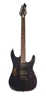 Guitar signed by Tom Petty: An electric guitar signed by Tom Petty, signed on October 29th of 2011 in North Ridge, CA. A black electric Dean guitar. Tom Petty was an American singer-songwriter, multi-instrumentalist, record