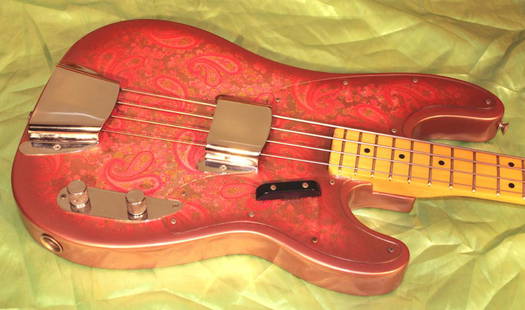 Pink Paisley 1969 Fender Tele Bass: 1969 Fender Telecaster bass, original pink paisley, near mint condition with original case. This spectacular Paisley Tele Bass is all-original, in excellent condition, and very rare. Other than one