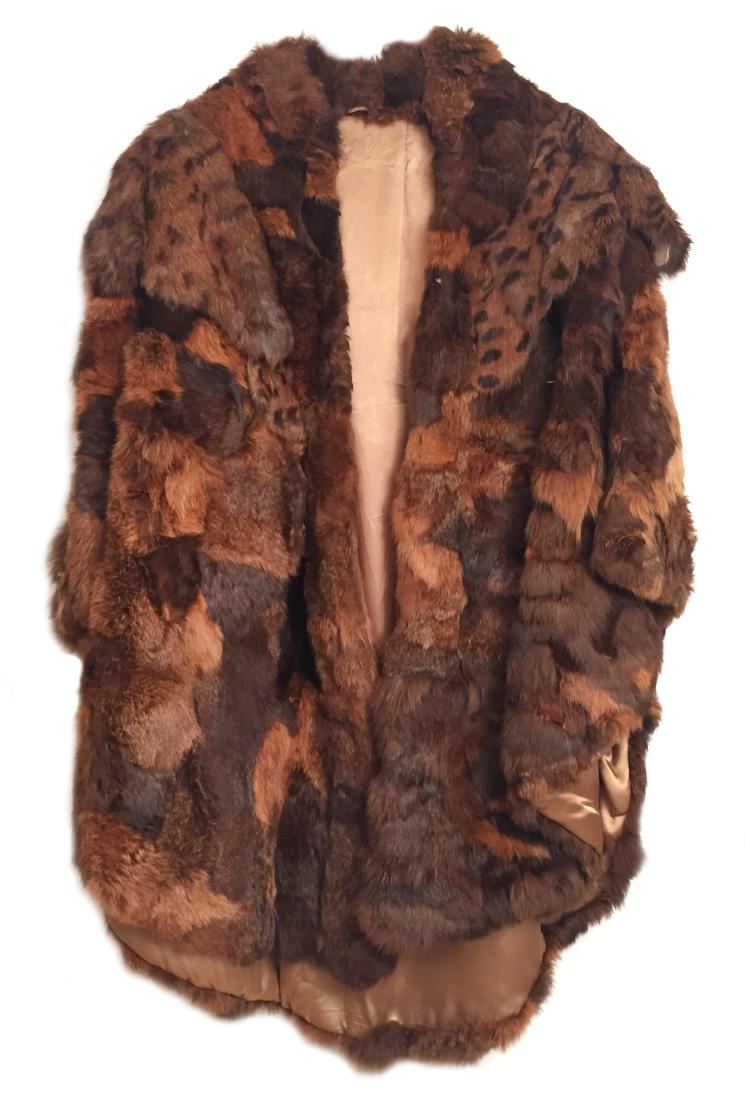 Hattie McDaniel Fur Coat: Silk-lined, tag removed. Cape style. Lapin. Rainbow of earth and rust tones. Two hook and eyelet closures. The actress Hattie McDaniel is most famous for her role as 'Mammy' in Gone With the Wind. Ple