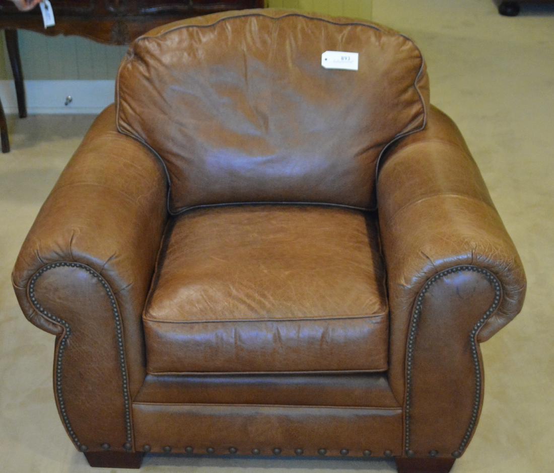 Art Deco Leather Club Chair: Brown leather upholstery. 46"W. x 36"D. x 36"H. Clubhouse Apartment. NO RESERVE. This lot was formerly the property of well-known real estate developer Mr. Melvin Simon and his wife, Bren Simon. It is