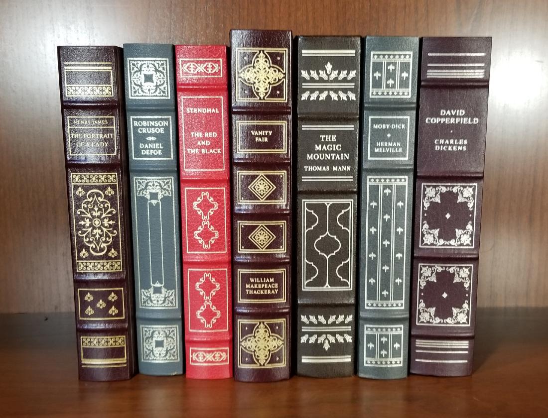 Franklin Mint Classics Series (7): Seven decorative imitation leather with spine raised bands and gilt elements. Titles are Vanity Fair, Magic Mountain, Robinson Crusoe, Red And The Black, Moby Dick, David Coperfield, Portrait of a Lad