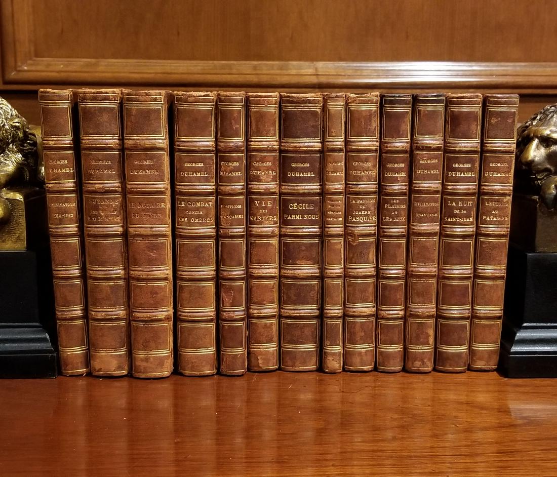 Decorative French Leather Bound Books (13): Decorative Leather Bindings. 13 decorative brown leather bindings, mostly odd volumes in French of works by George Duhamel, 3/4 leather with marbled paper covered boards, raised spine bands, most earl