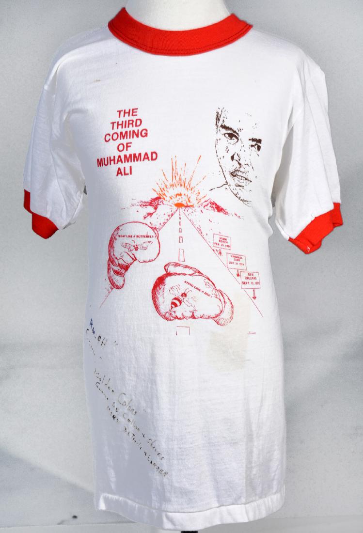 The Muhammad Ali / Bundini Brown Collection: Many described Drew "Bundini" Brown as Muhammad Ali's guru. Bundini was a friend, advisor and corner man to the Champ throughout Ali's long career. When Bundini died, he left a collection of t-shirts,