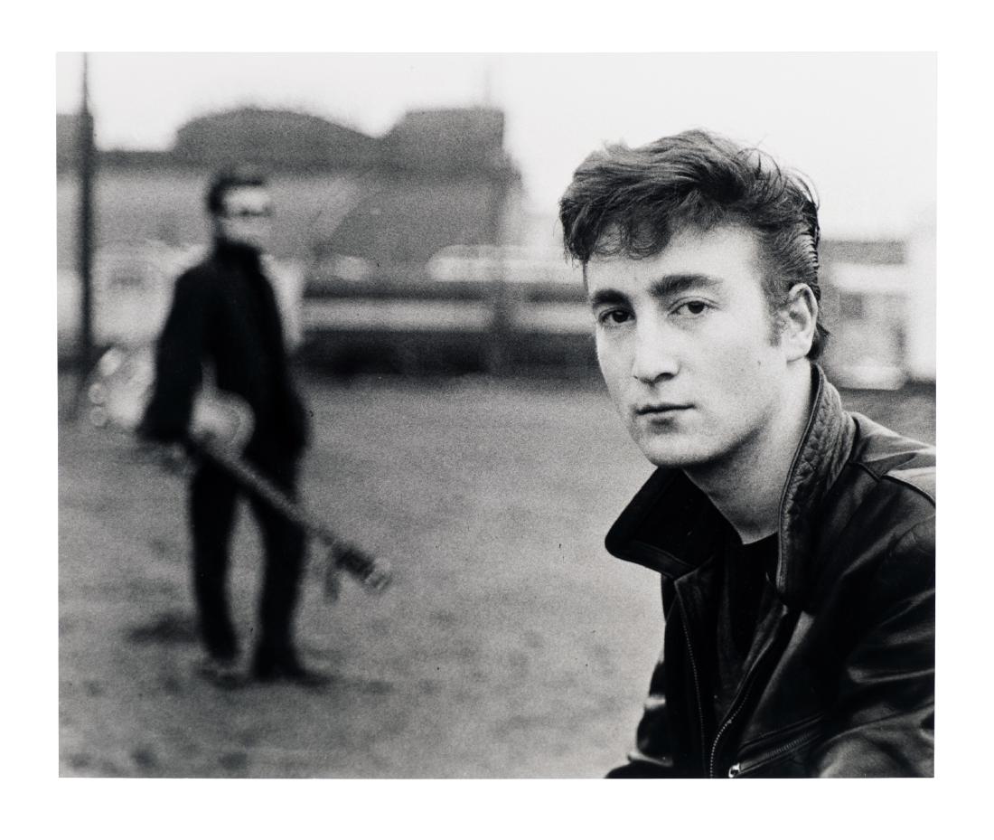 John Lennon Portrait by Kirchherr: John Lennon. A riveting portrait of a young John Lennon taken and printed by legendary photographer Astrid Kirchherr. 19.5"x 23.5". A vision of Stuart Sutcliffe appears in the background. This is an u