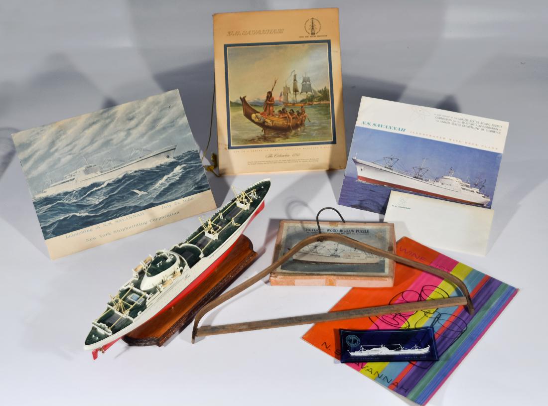 NS Savannah Ephemera: Eleven (11) items from onboard the NS Savannah ship including a clothing hanger, menus, a model, a jigsaw puzzle, and a ticket from the launching on July 21, 1959 in Camden, New Jersey. The lot contai