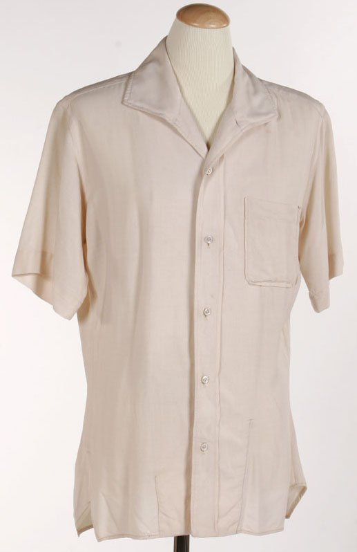 James Dean Shirt From "East Of Eden": James Dean's shirt from "East of Eden" (Warner Bros., 1955). A Warner Bros. production tag is sewn inside; dated May 27, 1954 and marked "Jim Dean." In excellent condition, with only very minor wear.
