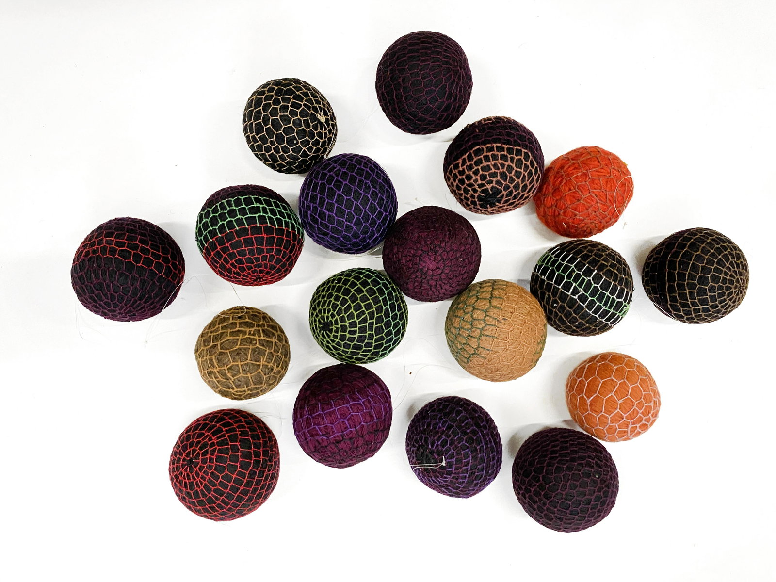 Eighteen Antique Amish Knit Balls: Eighteen antique Amish knit balls A unique collection of handcrafted Amish balls, C. 1900. This is an unreserved auction with no minimums. This is an online only sale. Items may be viewed upon appoint