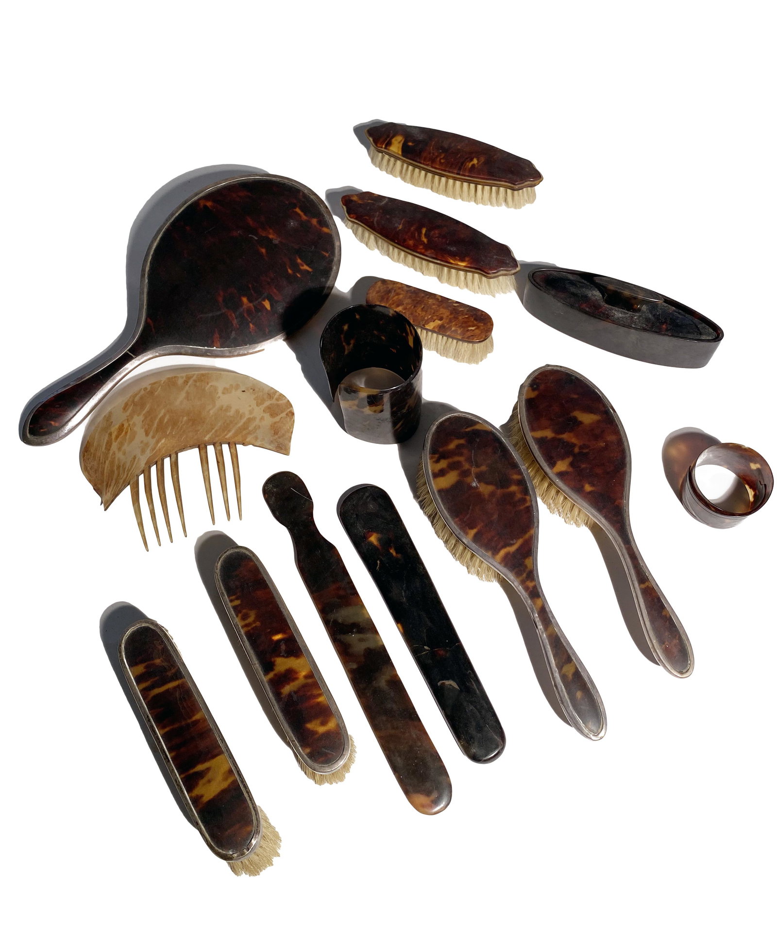 Vanity Set: Vanity Set Consists of fourteen (14) pieces including a sterling silver and mirror, two (2) hair brushes, five (5) hand brushes two (2) with sterling trim and three (3) without, two (2) shoe horns, a 