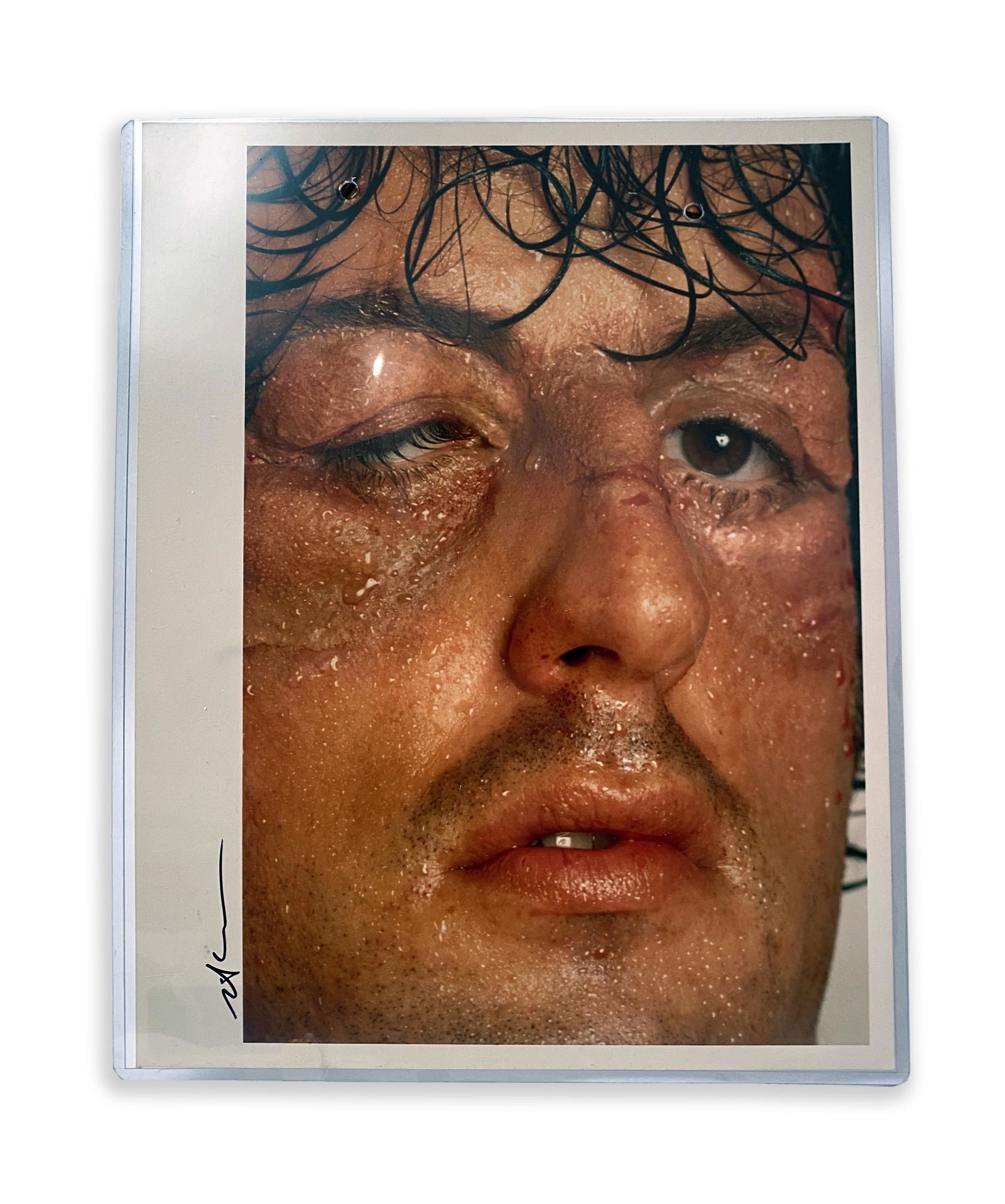 Vintage Print Neil Leifer Photograph of "Rocky": Vintage Print Neil Leifer Photograph of "Rocky" Color; C. 1976. Close-up of Sylvester Stallone as he appeared in Rocky. Signed in ink by Neil Leifer. 11" x 14" Neil Leifer is the foremost sports photo