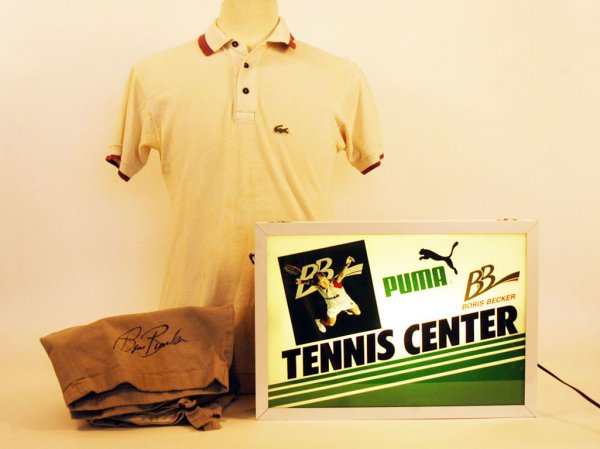 Boris Becker Practice Tennis Shirt, Shorts, and Li: Boris Becker Practice Tennis Shirt and Shorts. Used at Kings Island Ohio Tournament in 1985. Shorts are autographed by Becker. LOA. Also lighted shadow box of Boris Becker advertising Puma and Boris B