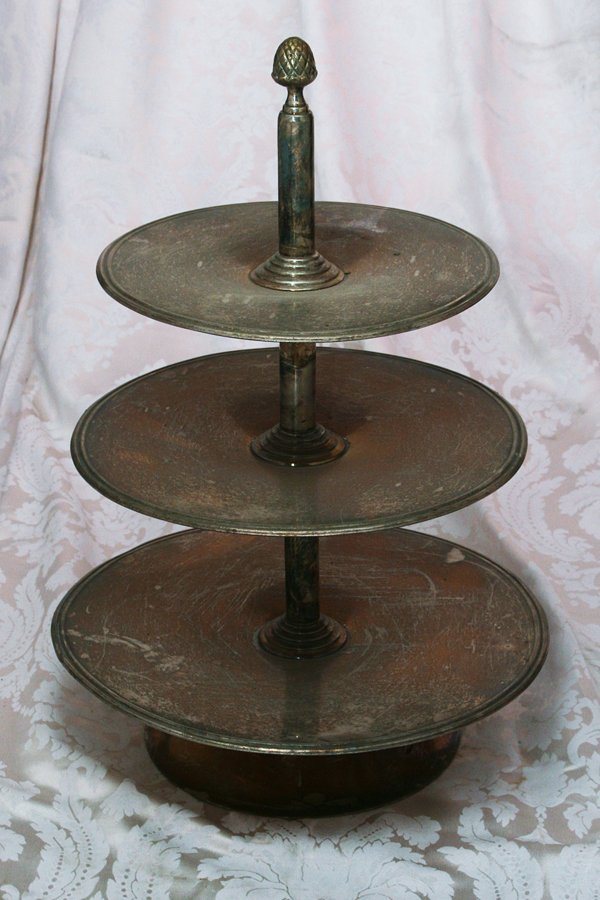 Three-Tiered Cake Stand with Acorn Finial: Silverplate three-tiered cake stand with an acorn finial. Approx. H28"