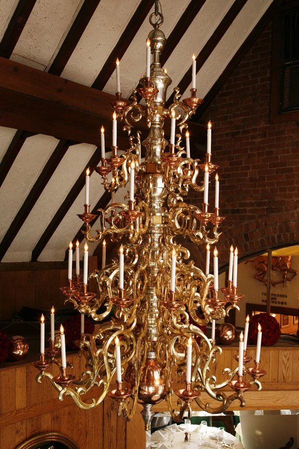 Brass and Glass Chandelier: One of a set of four William and Mary-style brass and copper 32-light chandeliers, this gleaming light fixture is what truly gives Tavern's Chestnut room a magnificently rustic feel. The elaborate rin