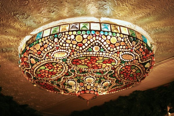 Art Nouveau-Style Tiffany Glass Hanging Lamp: Created in the early 1970's for the soon-to-be-opened Tavern on the Green, this circular Art Nouveau-style leaded glass ceiling lamp is crafted from Tiffany workshop glass, including square frogs' bac