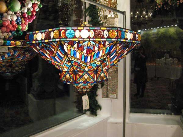 Art Nouveau-Style Tiffany Glass Hanging Lamp: Art Nouveau-style leaded glass ceiling lamp crafted from Tiffany workshop glass, including square frogs' back jewels, opalescent glass, and marbleized glass. It is accented in blue, white and red, has