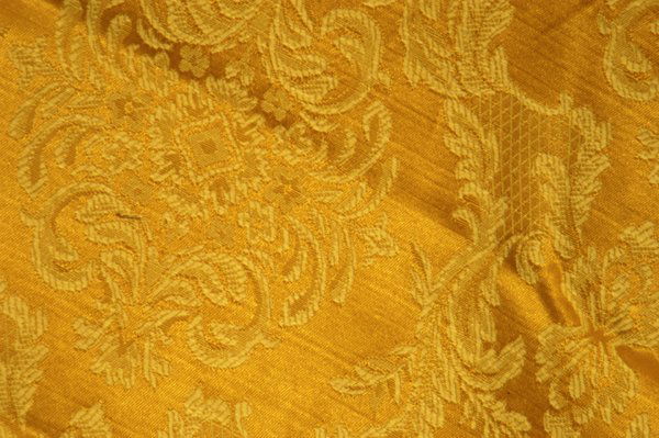 One Dozen Gold and Cream Jacquard Tablecloths: One dozen gold and cream-colored jacquard tablecloths once used at the Russian Tea Room. Round: 133"