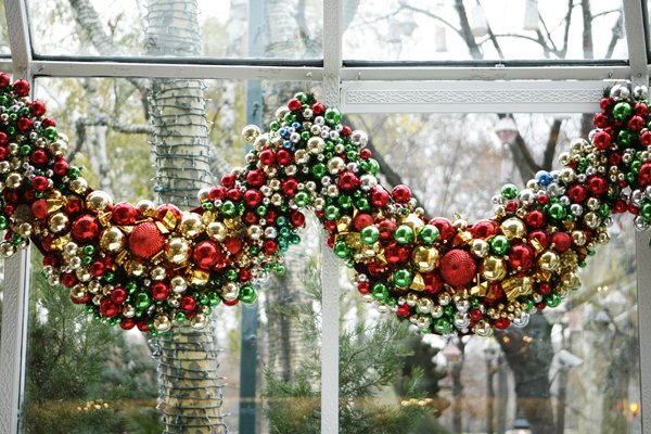 Ten Crystal Room Christmas Swags: Handmade Christmas swags created with a generous assembly of multi-colored balls with ribbons. Two representative swag sections shown. Each approx. 4'