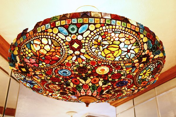 Art Nouveau-Style Tiffany Glass Hanging Lamp: Created in the early 1970's for the soon-to-be-opened Tavern on the Green, this circular Art Nouveau-style leaded glass ceiling lamp is crafted from Tiffany workshop glass, including square frogs' bac