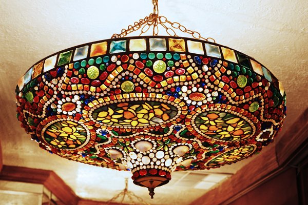 Art Nouveau-Style Tiffany Glass Hanging Lamp: Created in the early 1970's for the soon-to-be-opened Tavern on the Green, this circular Art Nouveau-style leaded glass ceiling lamp is crafted from Tiffany workshop glass, including square frogs' bac