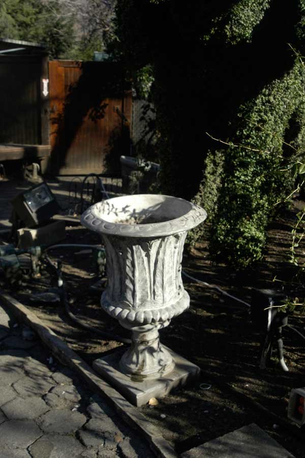 Pair of Planters from Crystal Garden: Pair of composition coating over concrete planters from Crystal Garden. H29"