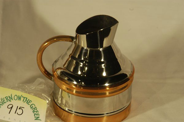 Engraved Wine "Pichets" from Maxwell's Plum : Approx. three dozen wine "pichets" with copper accents, in sienna-colored reptile print gift boxes. Inscribed "Chateau de la Chaise Brouilly Maxwell's Plum". 8"