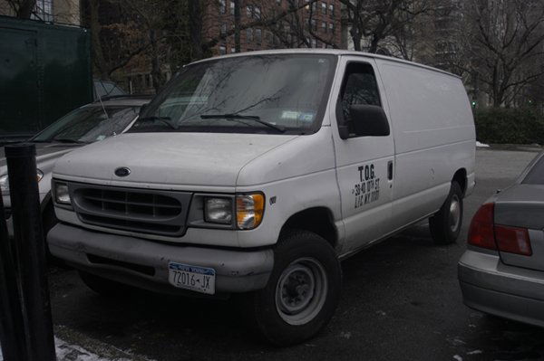 1999 White Ford Van: V8 engine, Model: E350 in white, 17' long, has 41,244 miles.