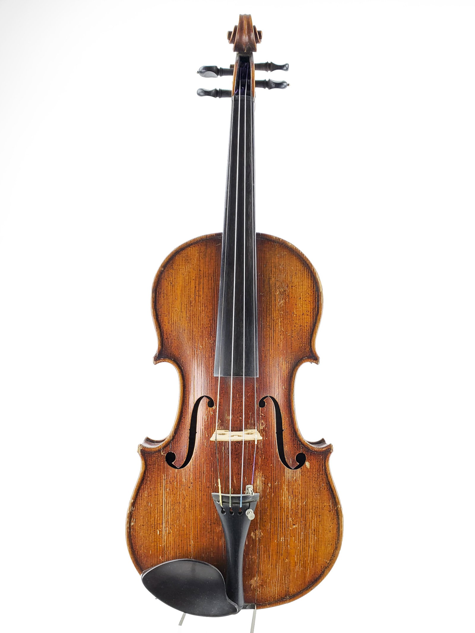 Violin, Labled "Made in Austria": Violin, Labled "Made in Austria" Branded "TIM" to the button. Multiple cracks on top lower bout. LOB 35.9cm. The Meisel Collection. This instrument is being sold from The Meisel Collection assembled o