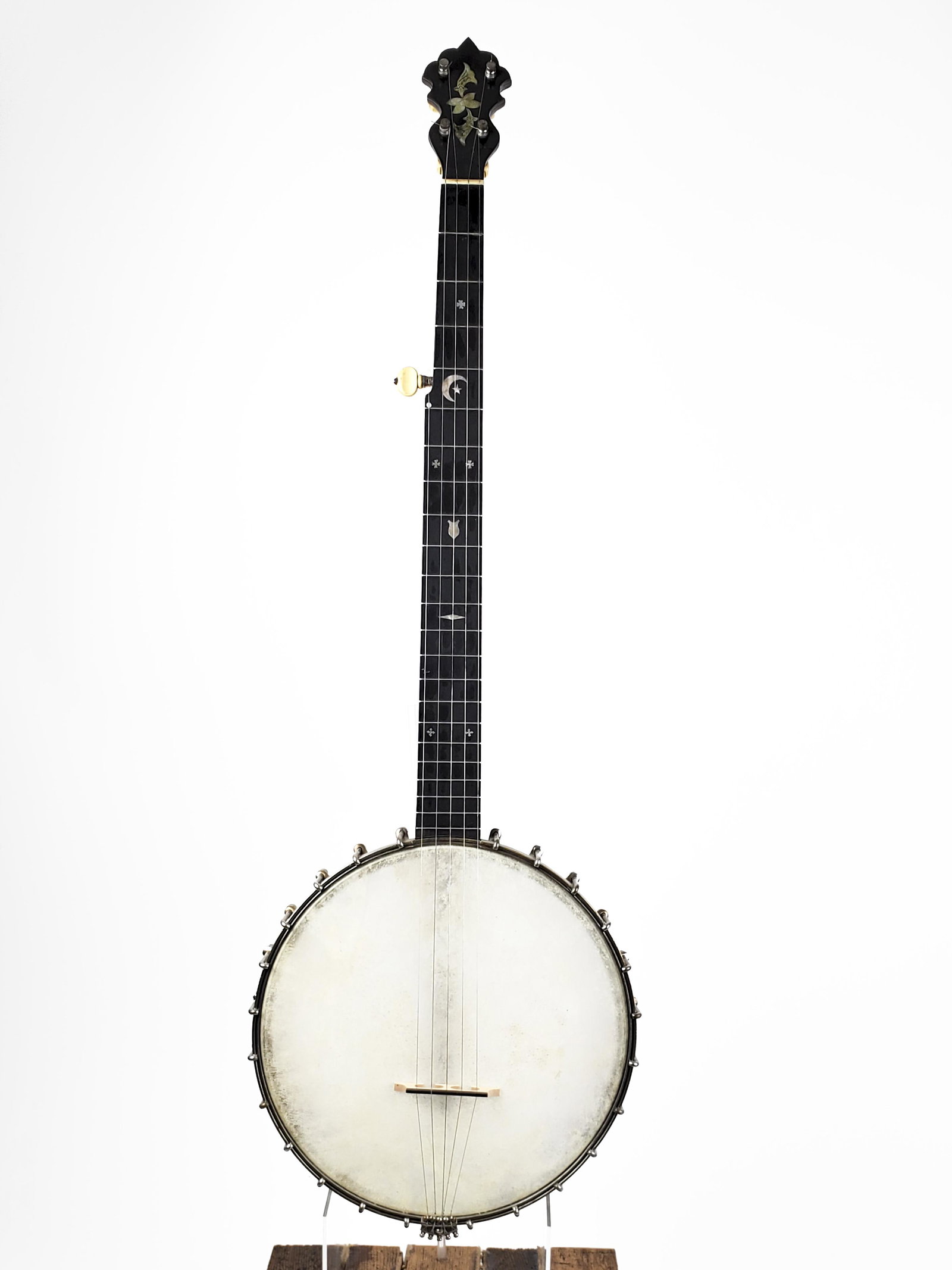 W.E. Stratton Banjo: W.E. Stratton Banjo Owner's initials inlaid in heel, mother of pearl. Lowell, Massachusetts. Length: 90cm. William E. Stratton was co-owner of the Stratton & Handley Music Store in Lowell, MA, c. earl