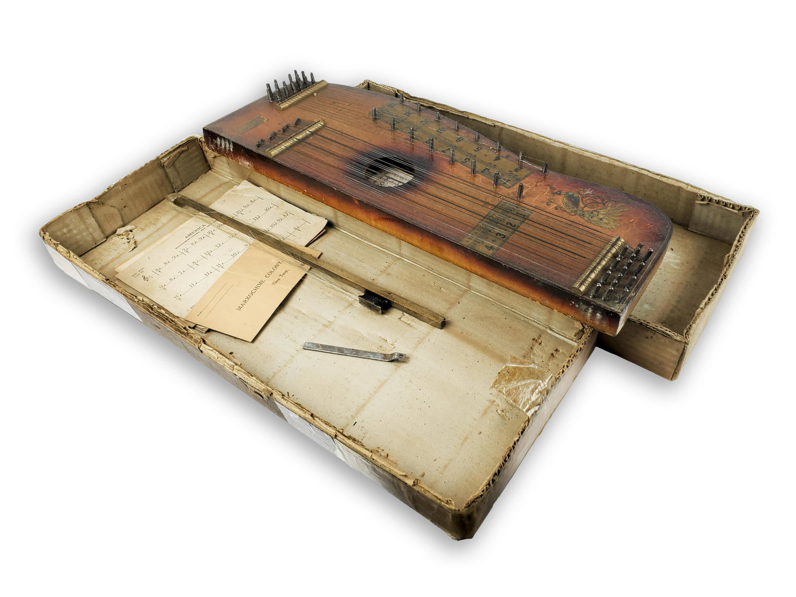 Marxo Chime Colony Marxo Chime: Marxo Chime Colony Marxo Chime New Troy, Michigan. Complete in original box with label on inside and original sheet music and bow. Length: 57cm. Priced $35 when new. Some craquelure to varnish. Very o