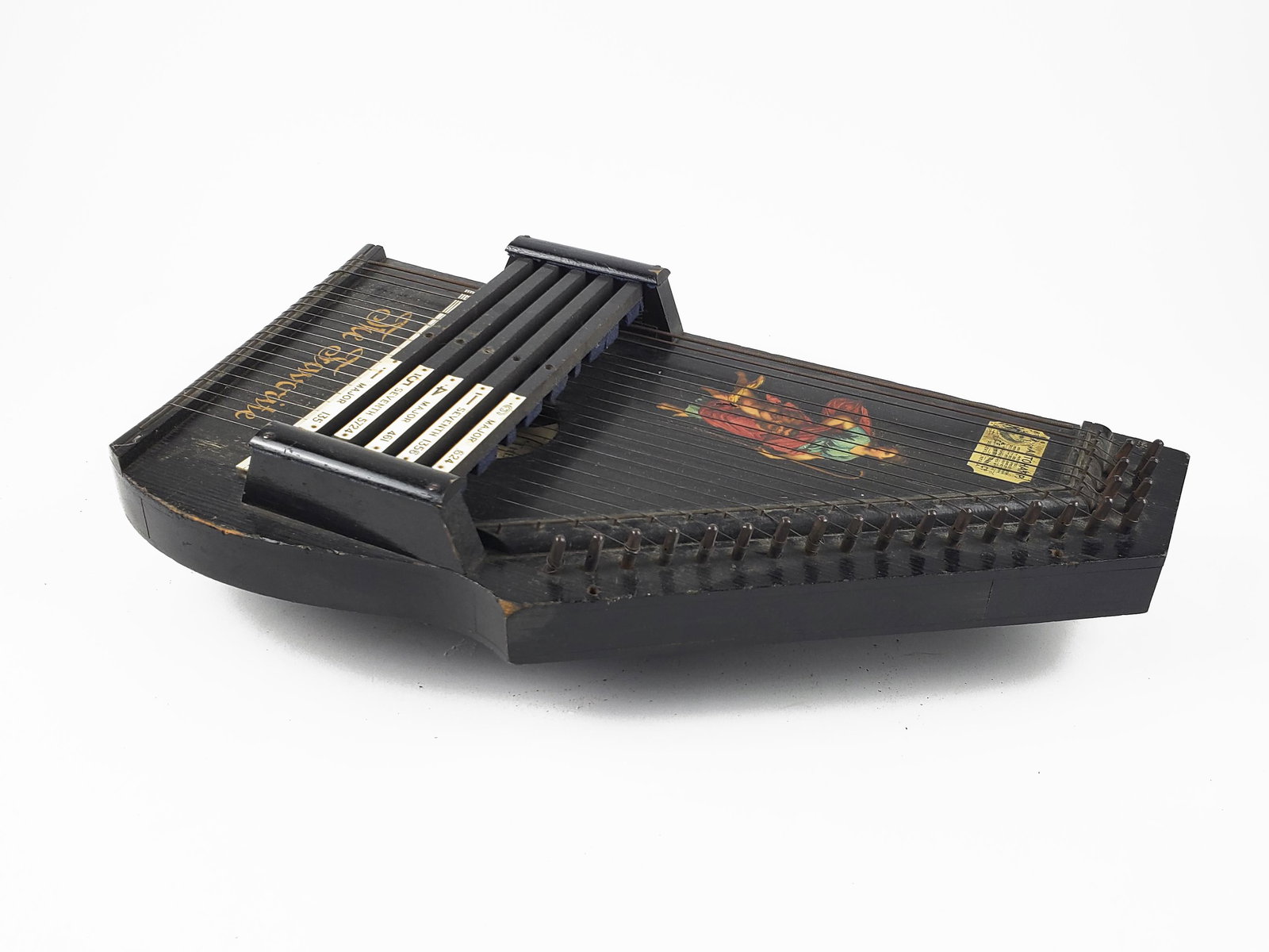 Zimmerman Autoharp, "The Favorite": Zimmerman Autoharp, "The Favorite" Lovely small instrument with original mythical-figured decal in excellent condition. Dolgeville, NY. "The Favorite." Nice patina with edge wear. Serial #: 2698 Lengt