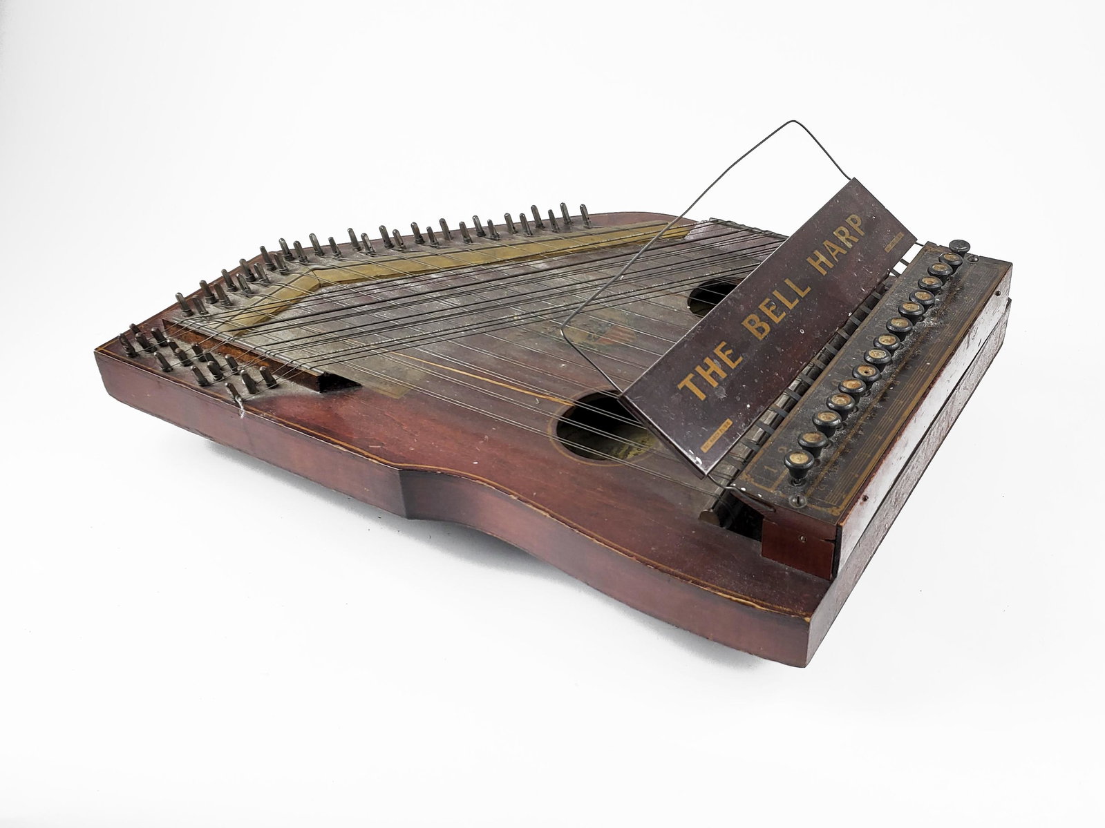 The Bell Harp Company Bell Harp: The Bell Harp Company Bell Harp Crack on back. Two cracks on the front traversing each sound hole. Length: 50cm. The Meisel Collection. This instrument is being sold from The Meisel Collection assembl