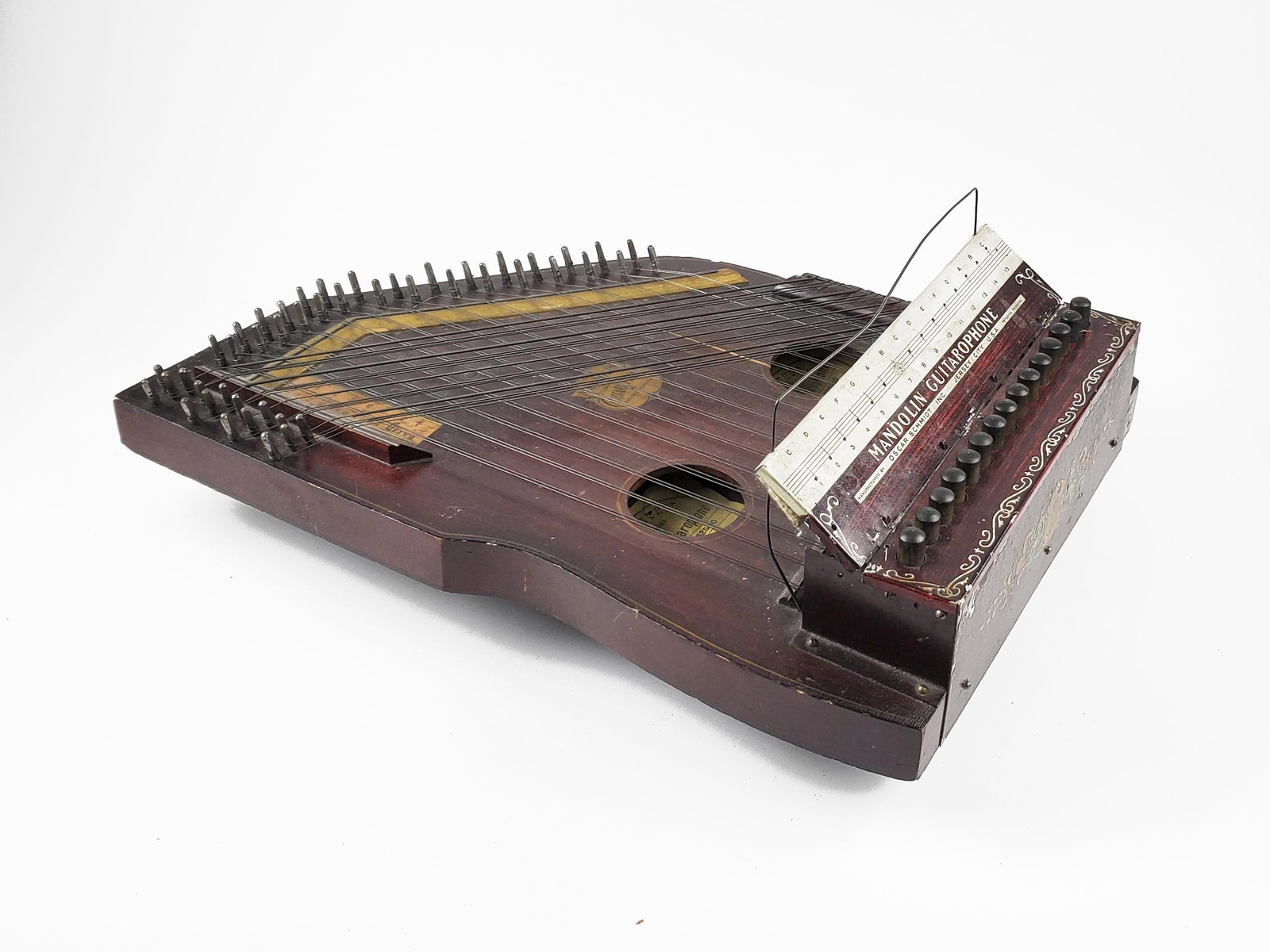 Oscar Schmidt International Mandolin Guitarophone, c.: Oscar Schmidt International Mandolin Guitarophone c. 1917. Jersey City, NJ. "Liberty Model." Crack on top. Length: 51cm. The Meisel Collection. This instrument is being sold from The Meisel Collection