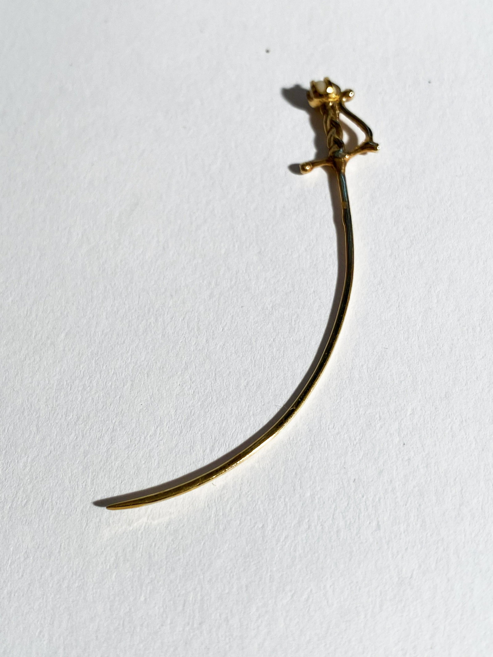 Saber Earring with Pearl Recovered from The Santa Margarita: A single saber earring with a single pearl recovered from The Santa Margarita. On June 10th, 2007 the crew of the vessel Blue Water Rose, while working on the site of the Santa Margarita, made a fabul