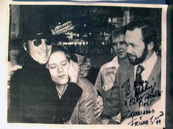 John Lennon w/ Zaxariades, Gerardo Velez: Two images of John Lennon w/ Zaxariades, Gerardo Velez. 8.5X11'' and 8X10'' B/W images. Inscriptions read: "To Henry's @ Manny's A Blast from the past Zaxariades+Friend" and "To Manny's and my friend 