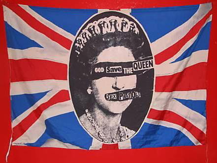 Jamie Reid Promotional "God Save the Queen" Flag : A rare original oversize promotional flag for the 1977 Virgin Records' single by the Sex Pistols 'God Save The Queen', signed by Jamie Reid. 29.5 x 41.25 inches