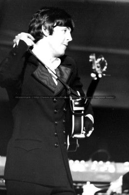 Two Photographs of Paul McCartney and Ringo Starr: Two photographs from the 1966 Beatles concert at St. Louis's Busch stadium, one of Paul McCartney shouldering his guitar near the end of the concert, and one of Ringo Starr looking left at his drum ki