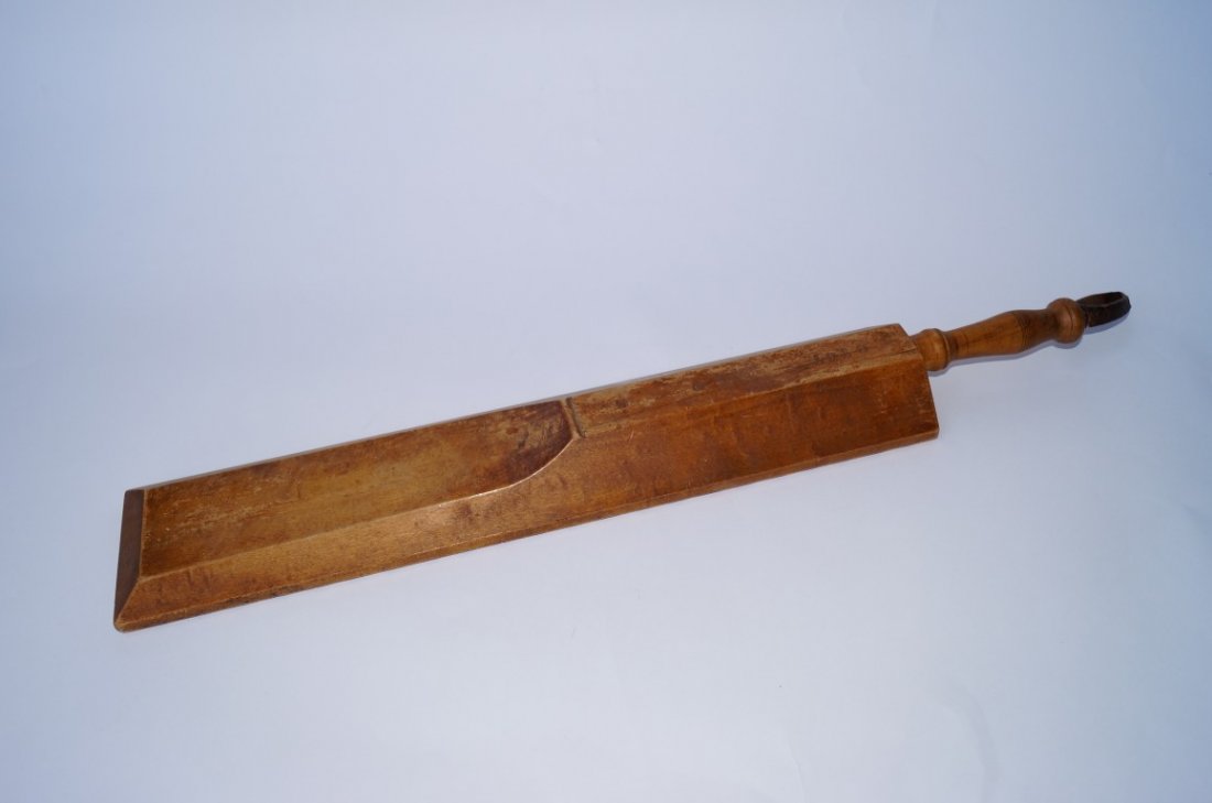 Bed Smoother: Carved wood. C. 1918. 28"L.