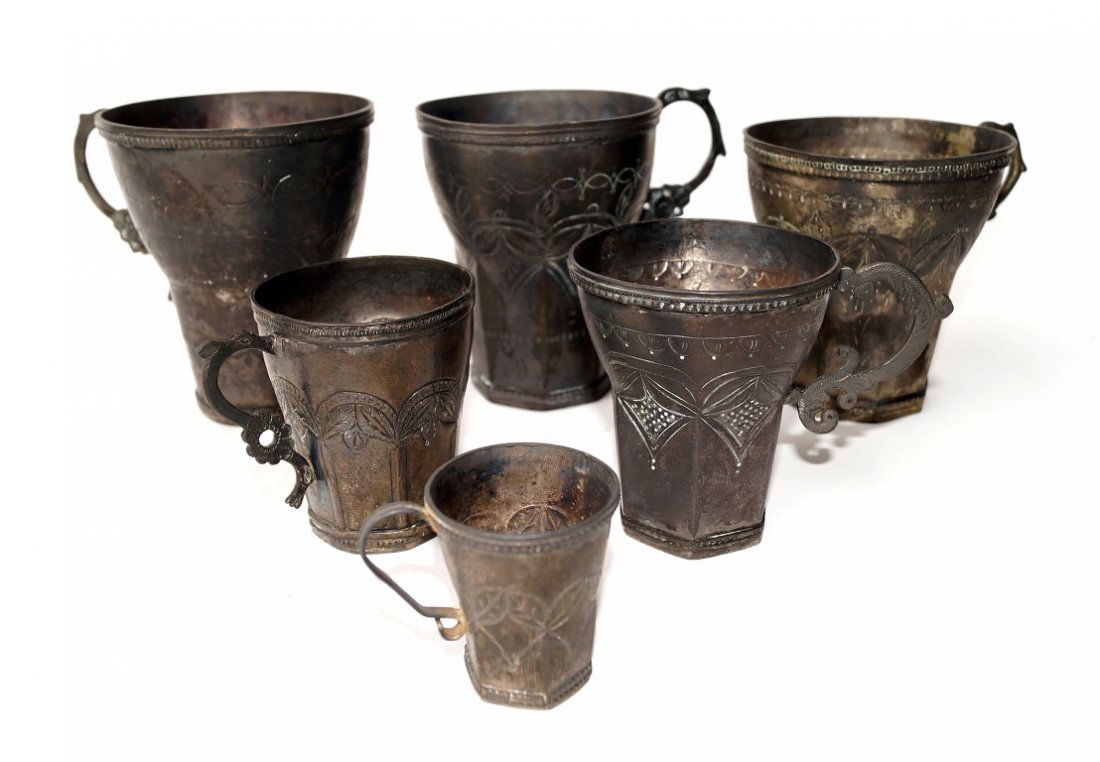 Spanish Colonial Silver Jarro (6): Chased silver handled cups Varying sizes. 4 1/2" to 2 1/8".