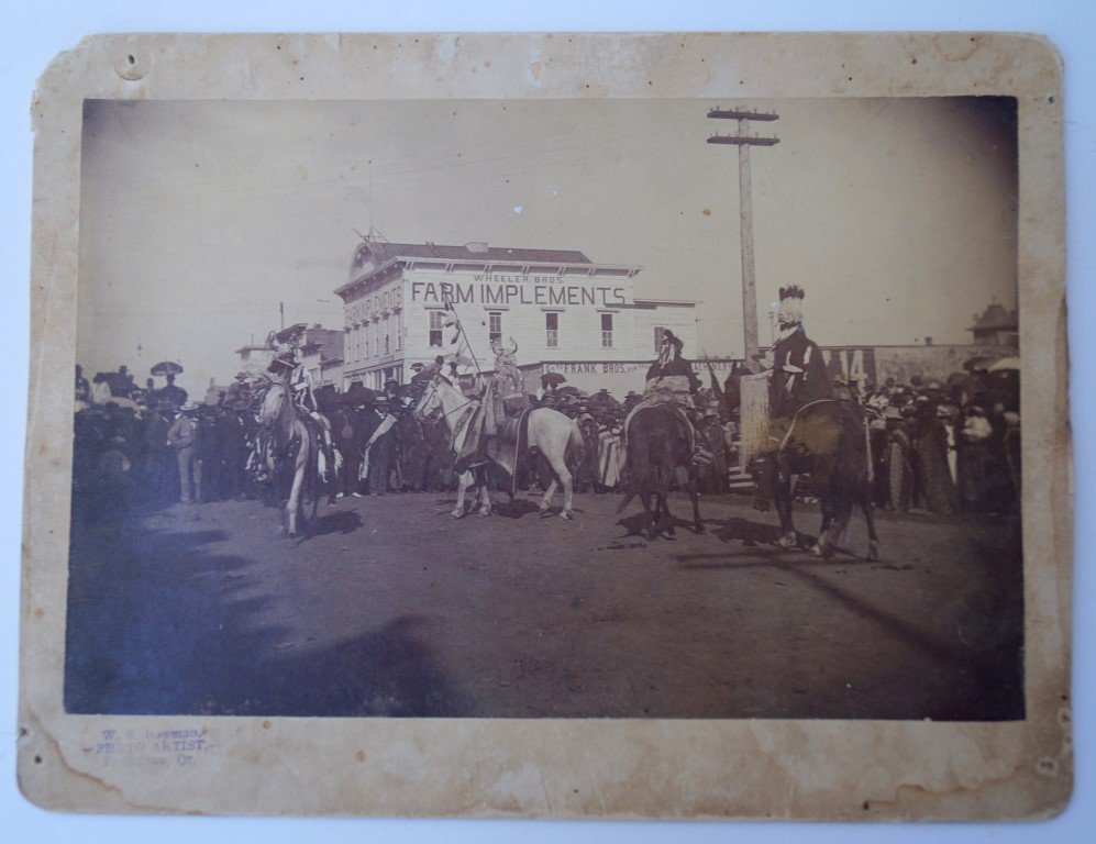 Photograph, Oregon Indians: Wheeler Bros Farm Implements Store in the background. By W. S. Bowman, photo artist, Pendleton, Oregon 7" x 9"