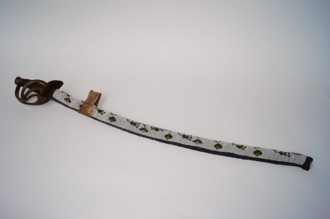 Sword with Elaborate Beadwork Case: Hand sewn elaborate beadwork case. (Sword blade has some rust spots)
