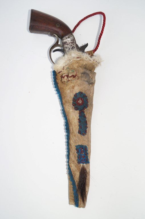 Stevens New Model Pocket Rifle: Second Issue. 32 center fire calibre. Indian pistol. Missing stock. Barrel replaced. Beadwork holster. . Fur decorated, fabric and horsehair trim to the beaded holder.