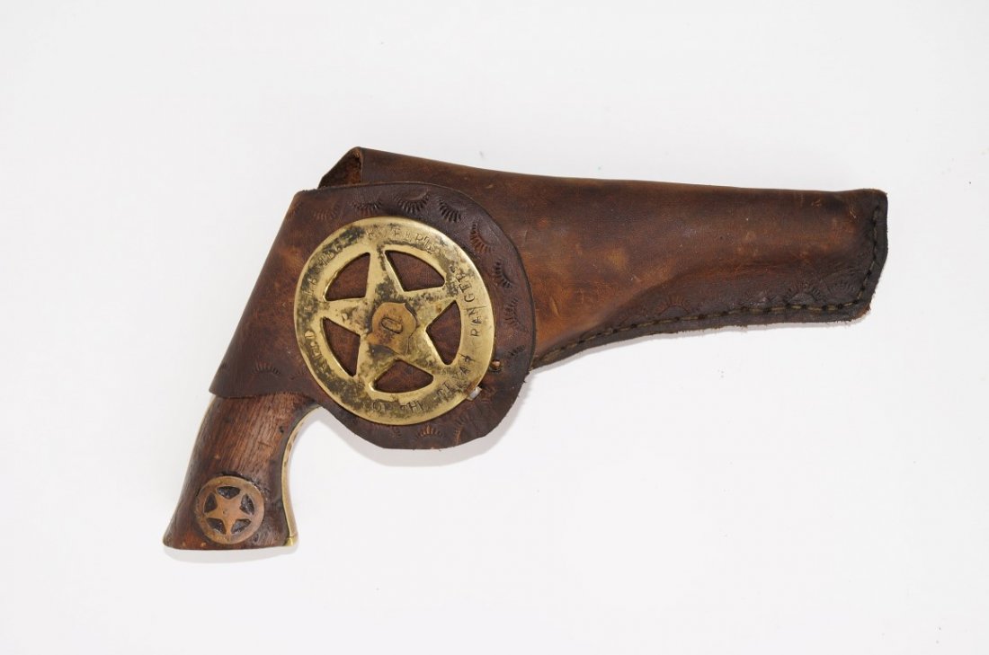Colt Pocket Revolver: Serial Number 314209 Colt 1849 pocket revolver converted to 38 rim fire. Daniel W. (Webster) Roberts Texas Ranger. With holster. Badge of Roberts applied to the holster Good overall condition.