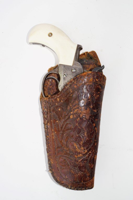 Colt Model 1877 Lightning Revolver: Non-functioning. Calibre 38 Colt. 3 1/2" barrel. Ivory grips which are in excellent condition. With floral embossed holster marked A. L. Clay , town difficult to read, Oklahoma