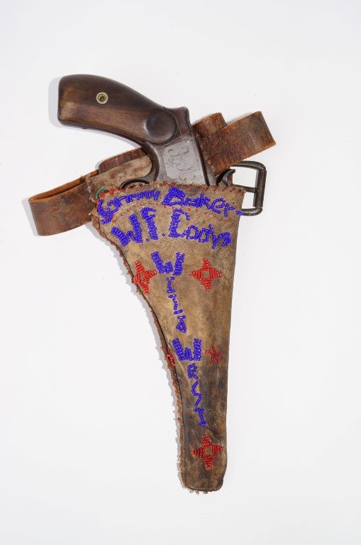 Smith & Wesson Model 3 Revolver: Second Model Russian. Commercial. 44 calibre. Operational. Fair condition. Marked J. B. for Johnny Baker, Buffalo Bill's Wild West Show. In a hide holster with beadwork for same on a belt.