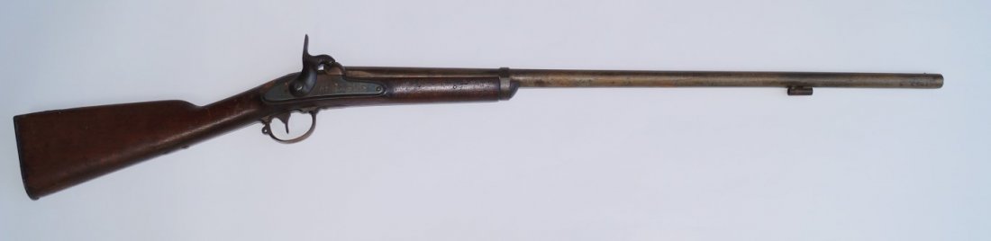 Springfield Model 1842 Musket: U. S. Percussion Contract Musket , Palmetto Armory Variant, 69 calibre smooth bore. Barrel marked PV with palmetto tree. Stock has been cut. Ramrod missing. Barrel cut to 34"